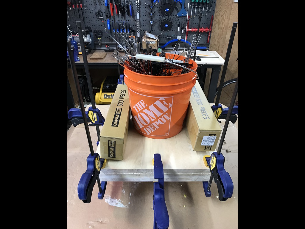 Clamped and weighted to cure